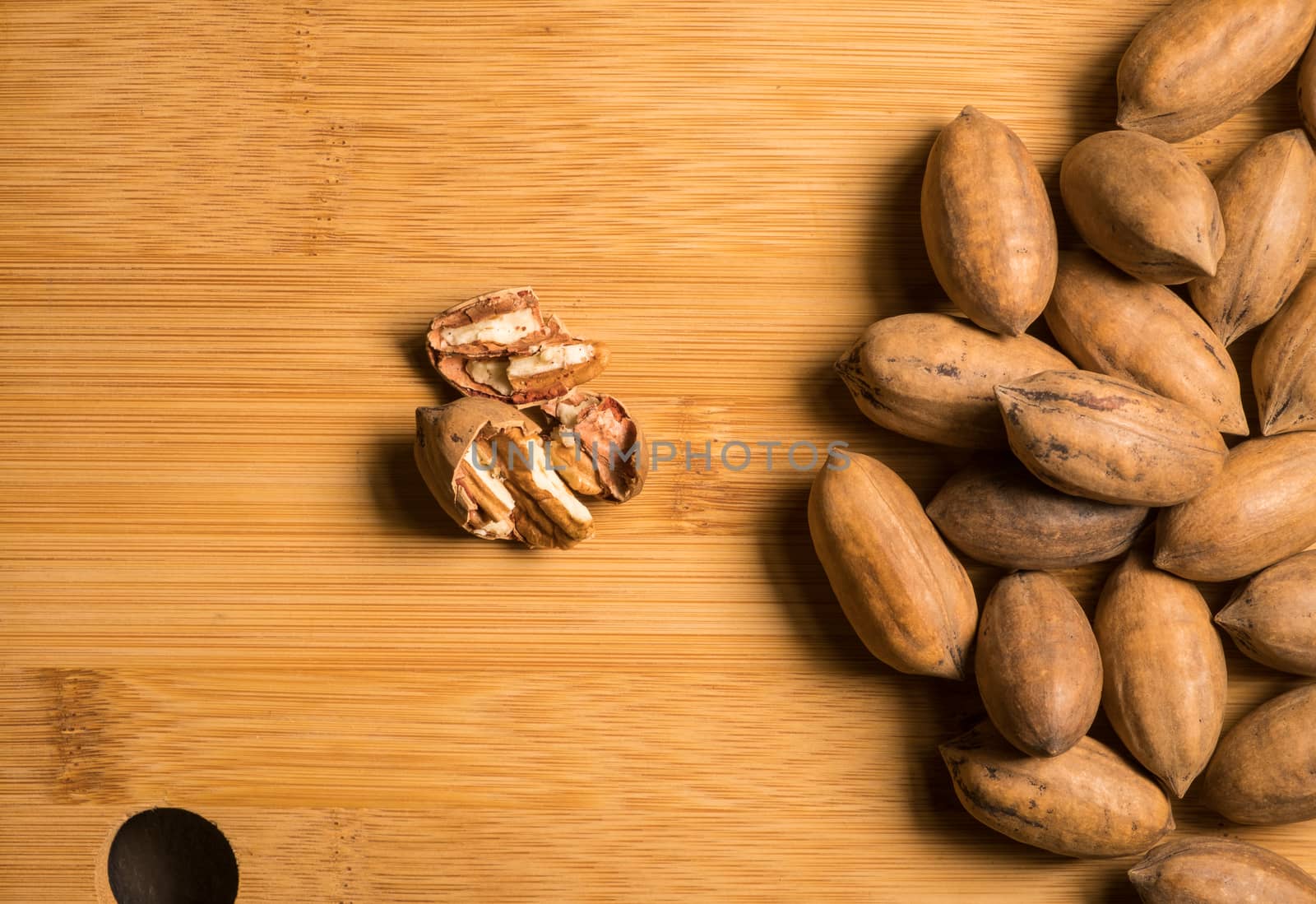 Pecan nuts on slate stone isolated
