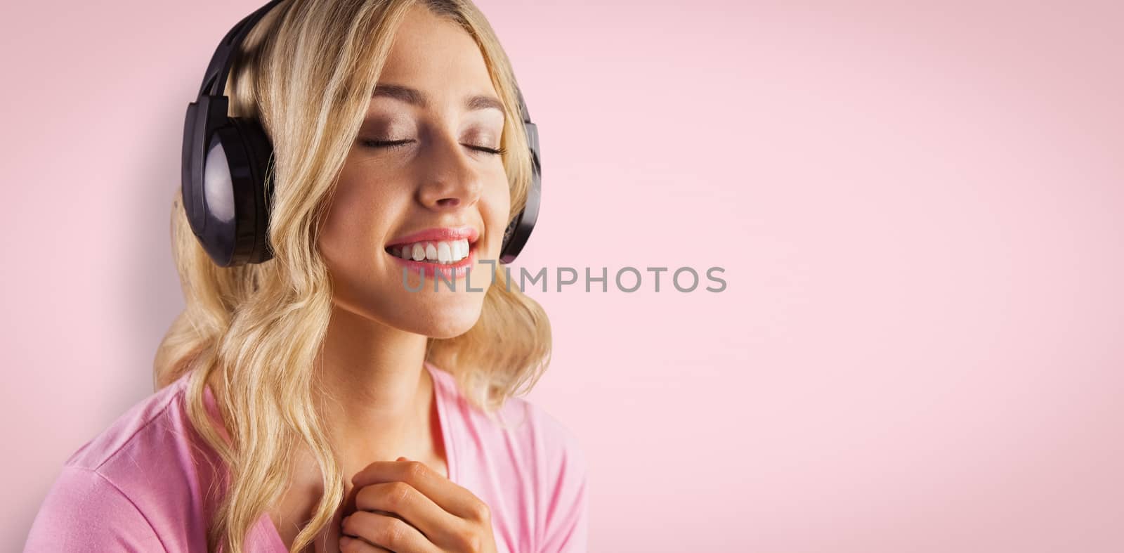 Close up of a woman listening to music  against red vignette