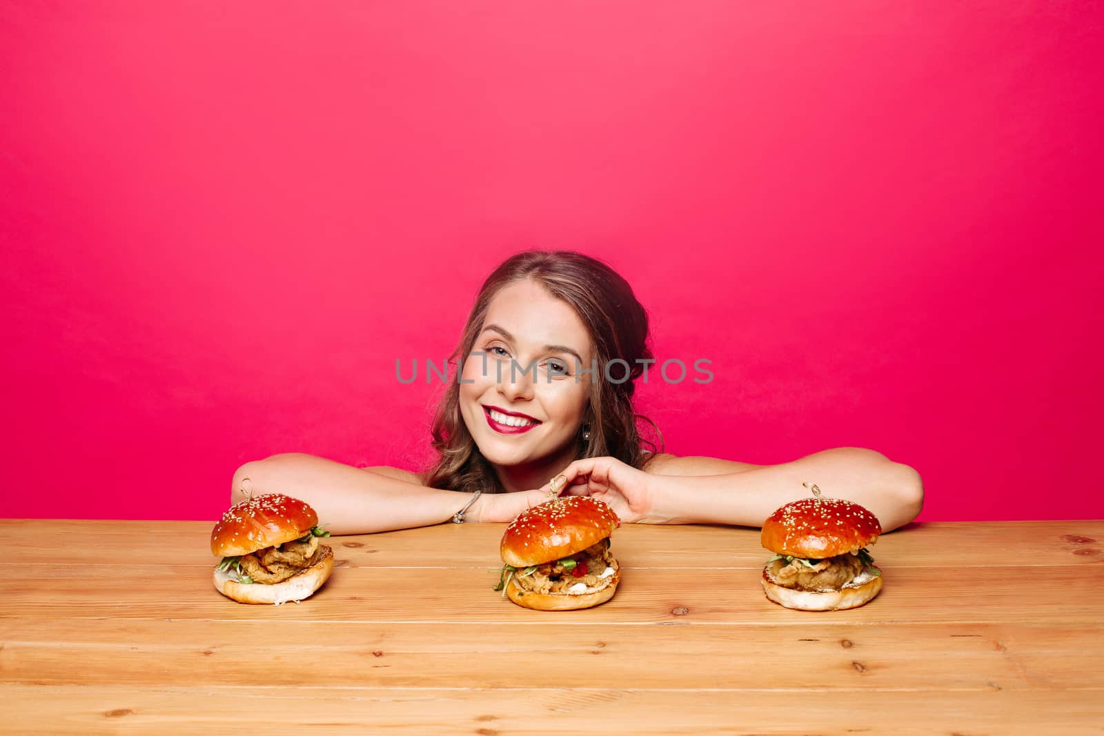 Lovely girl with hamburgers by StudioLucky