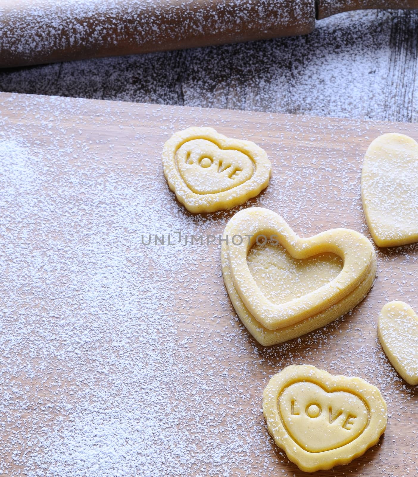 Homemade cookies for valentines day over wooden table