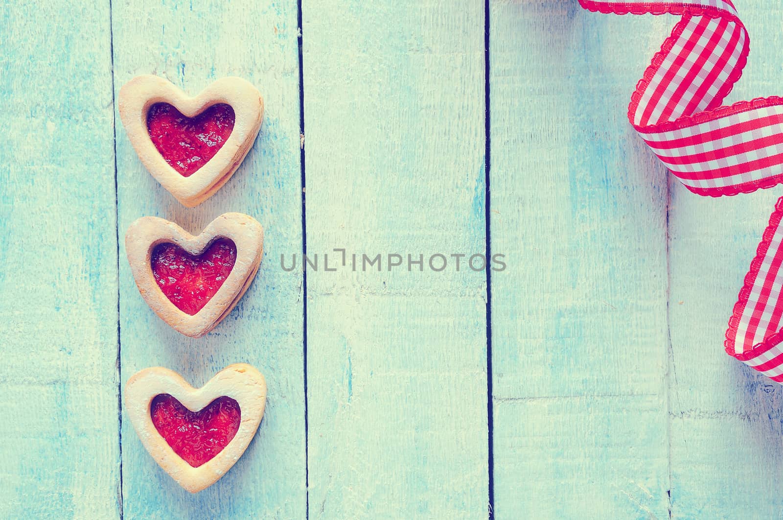 Homemade cookies for valentines day over wooden table