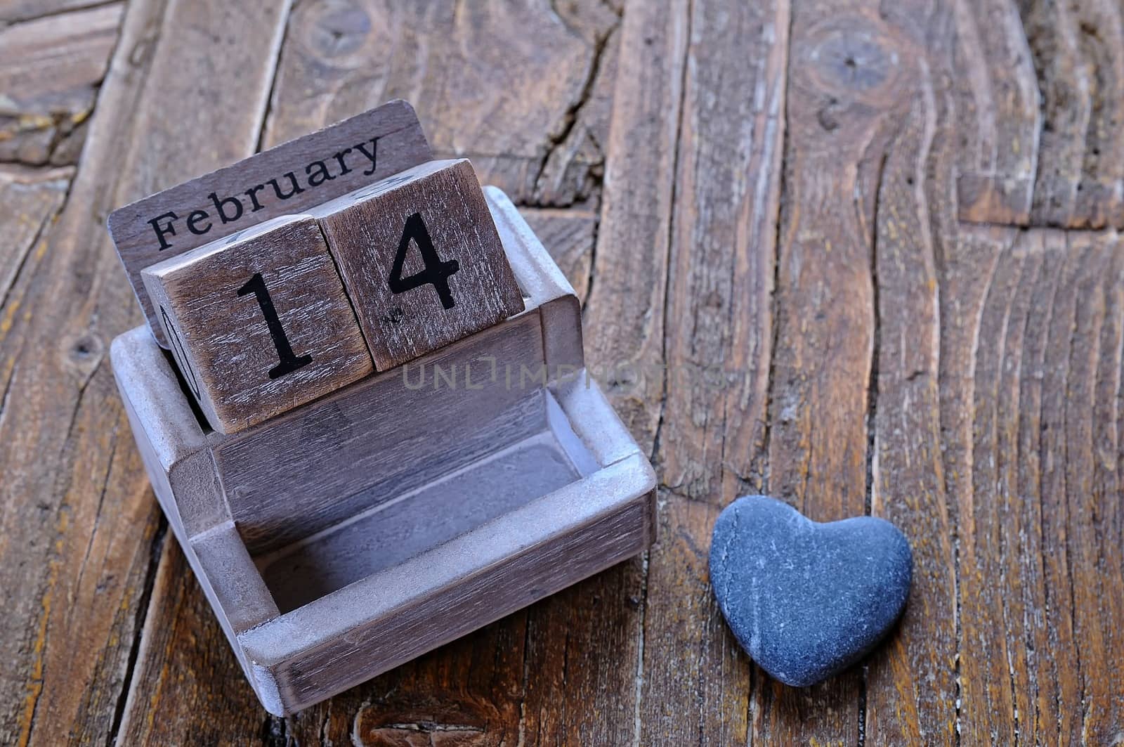 Calendar on date February 14 on the wooden table