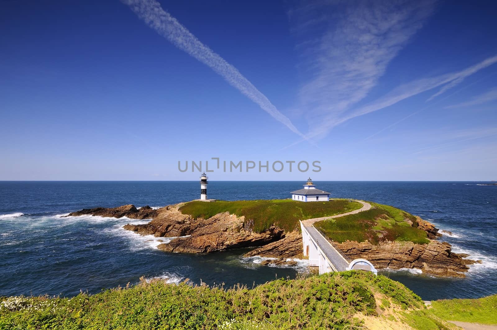 Pancha Island Lighthouse on the coast of Ribadeo, Lugo, Spain.