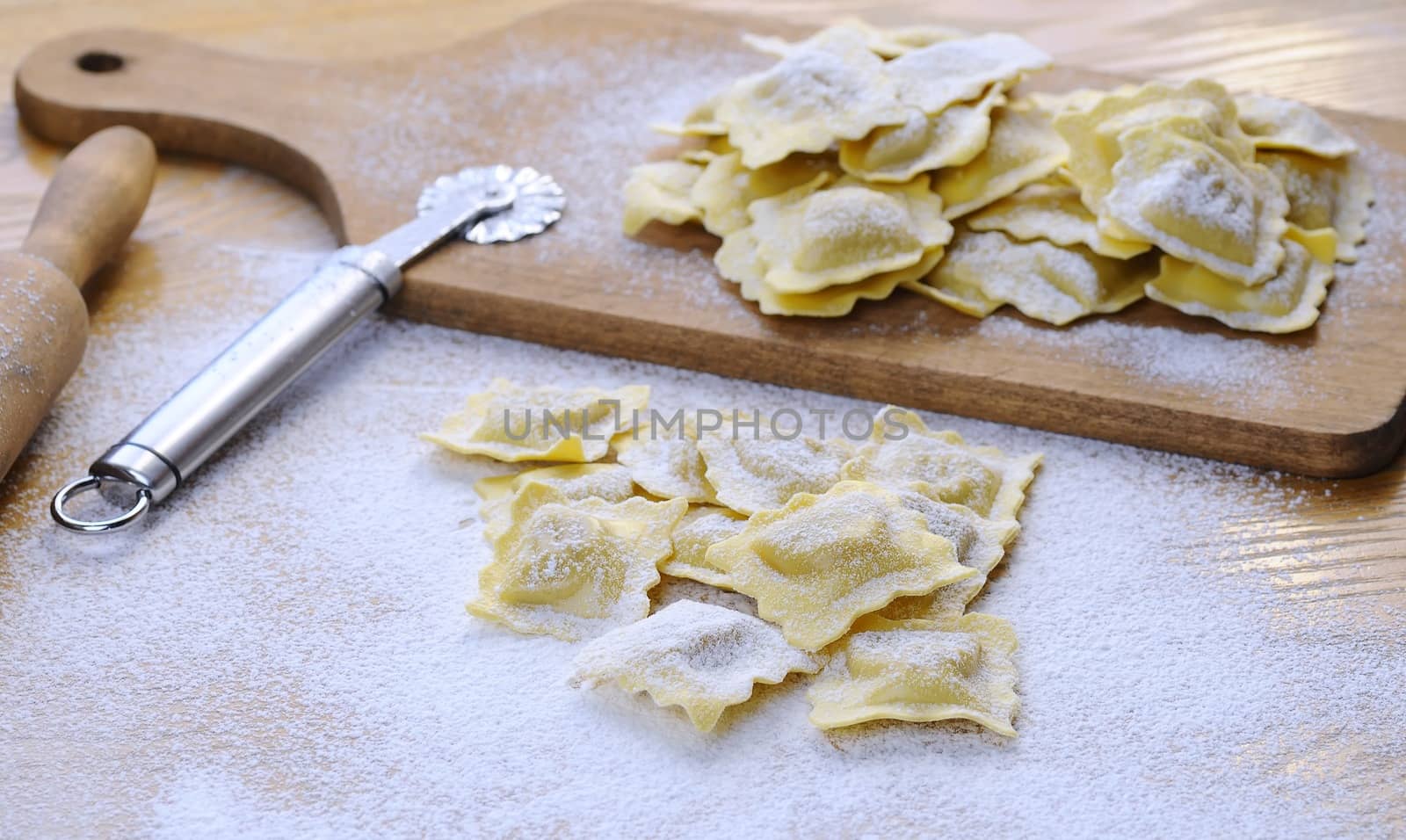 Preparing fresh ravioli at the kitchen table.