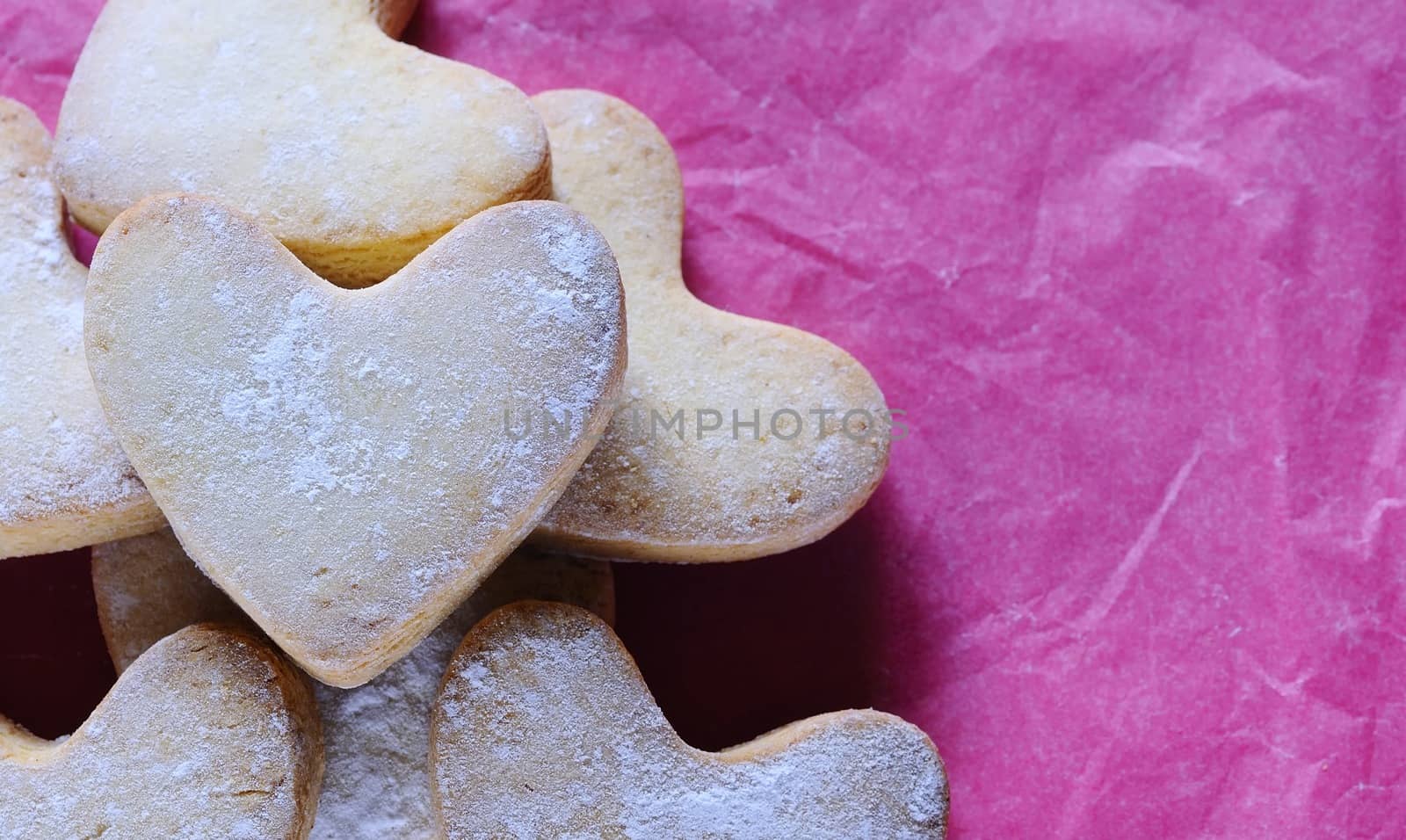 Homemade cookies for valentines day over wooden table