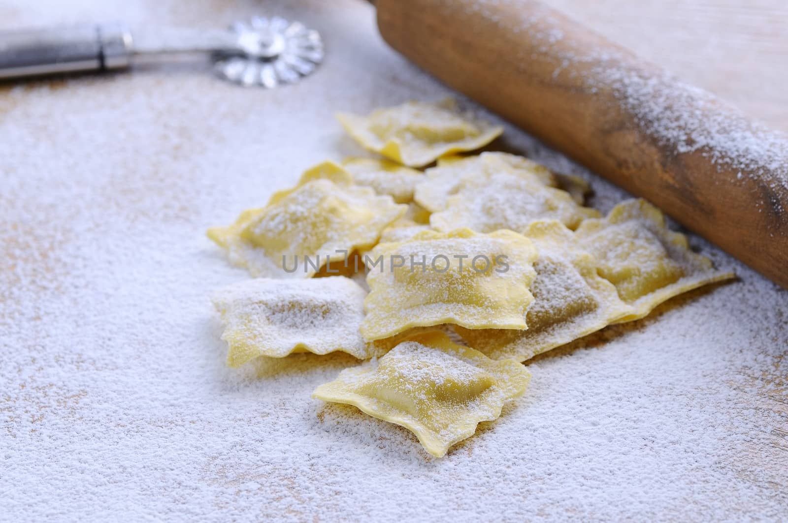 Preparing fresh ravioli at the kitchen table.