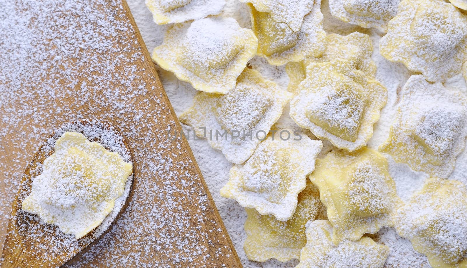 Preparing fresh ravioli at the kitchen table.