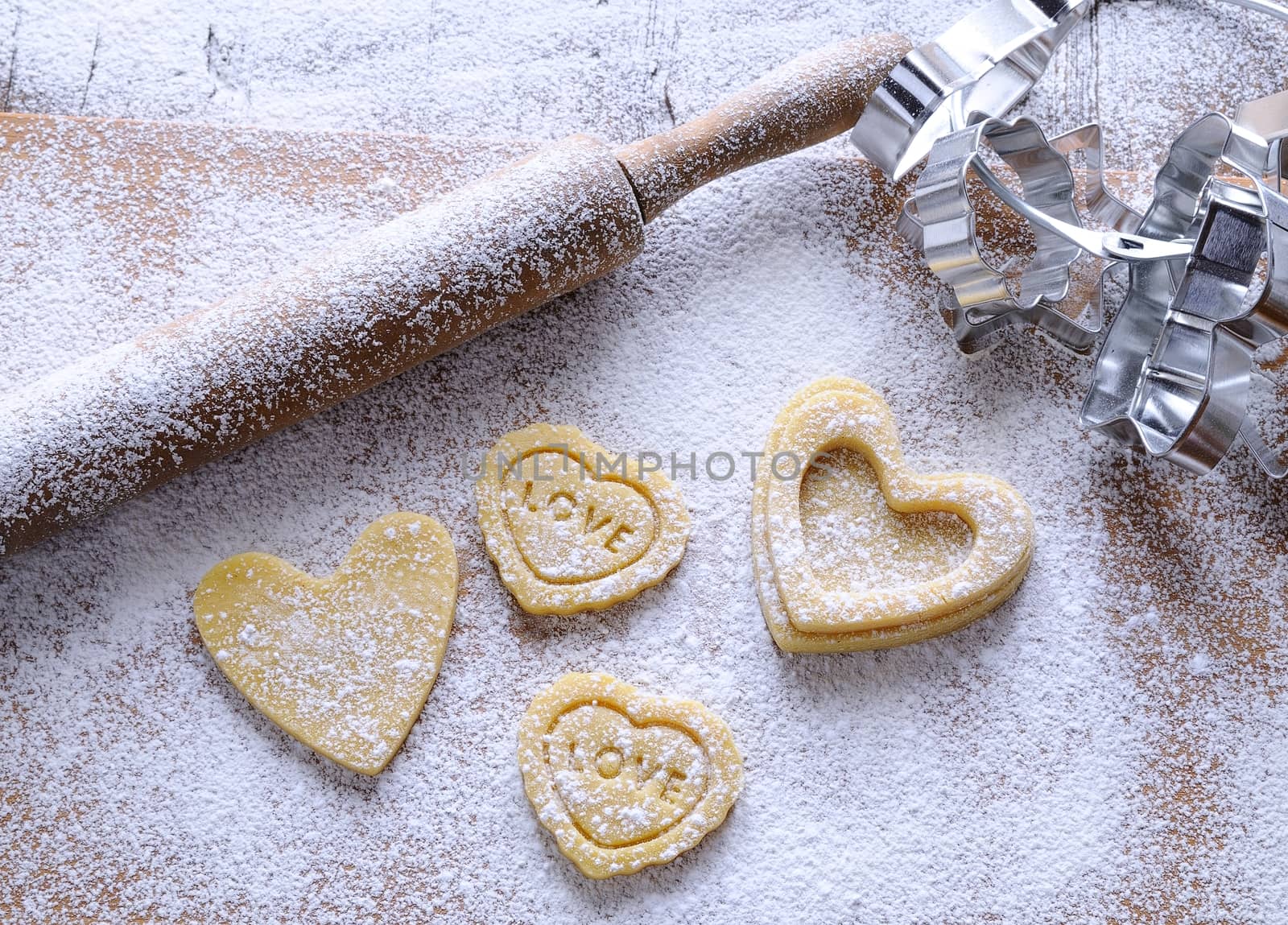 Homemade cookies for valentines day over wooden table