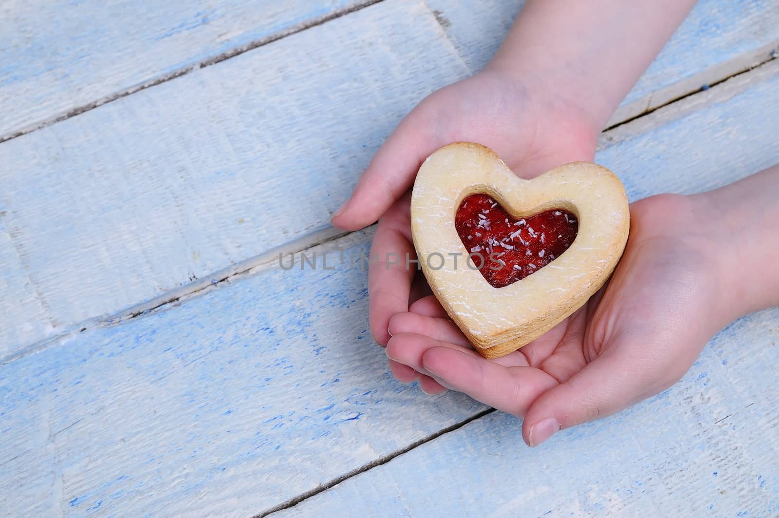 Homemade cookies for valentines day over wooden table