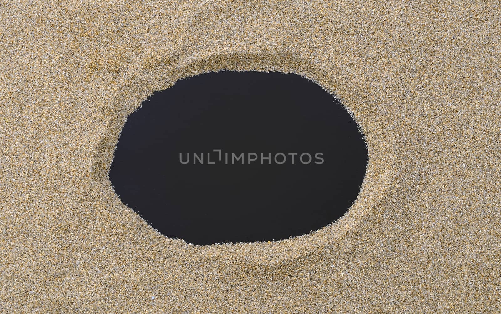 Blackboard with copy space on beach sand.