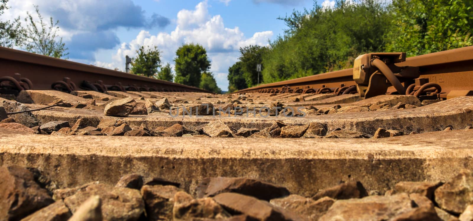 Multiple railroad tracks with junctions at a railway station in  by MP_foto71