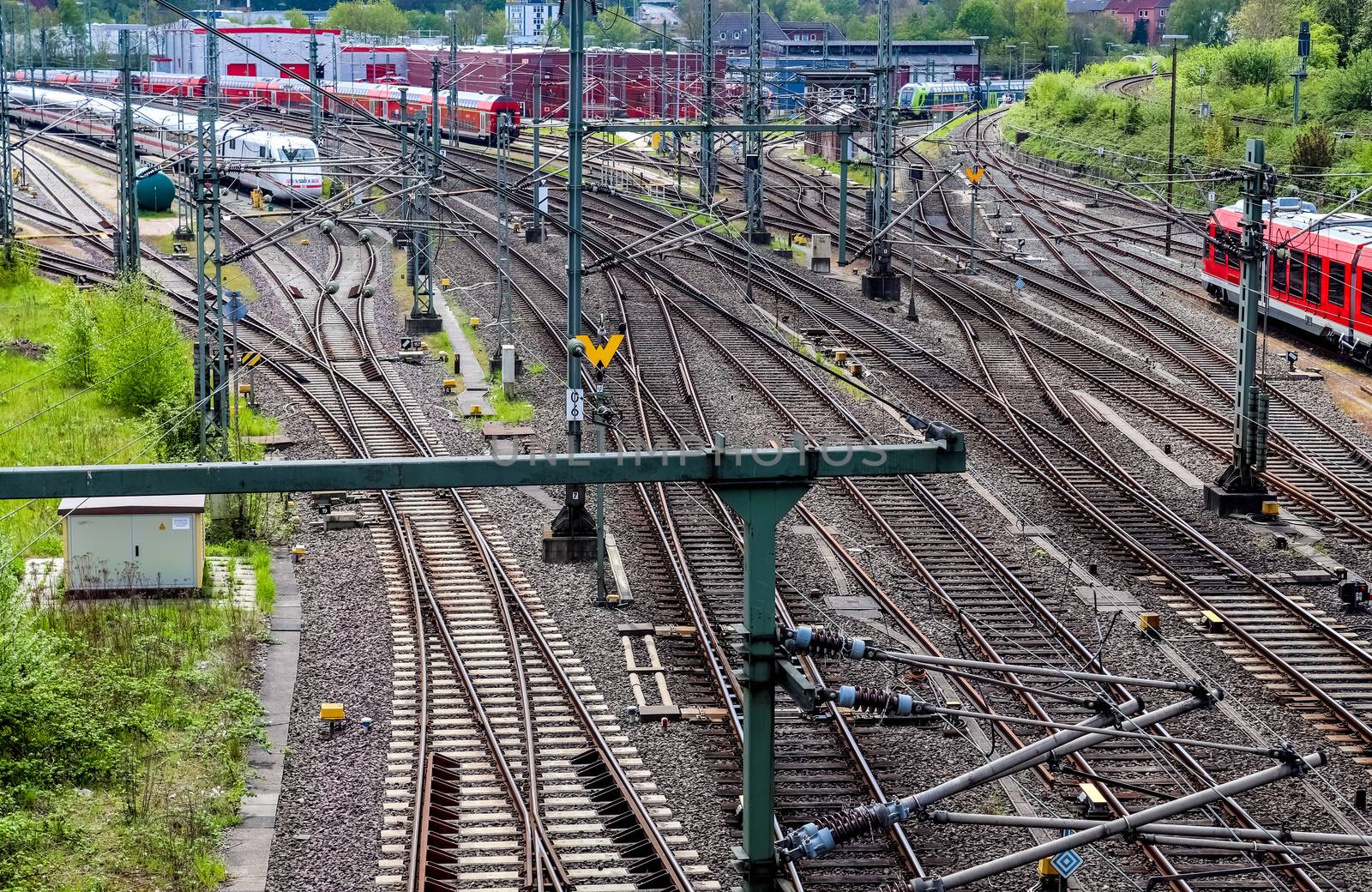 Multiple railroad tracks with junctions at a railway station in  by MP_foto71