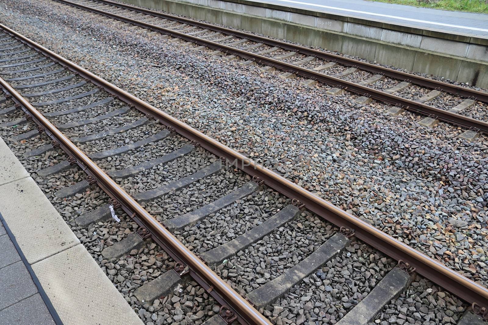 Multiple railroad tracks with junctions at a railway station in  by MP_foto71