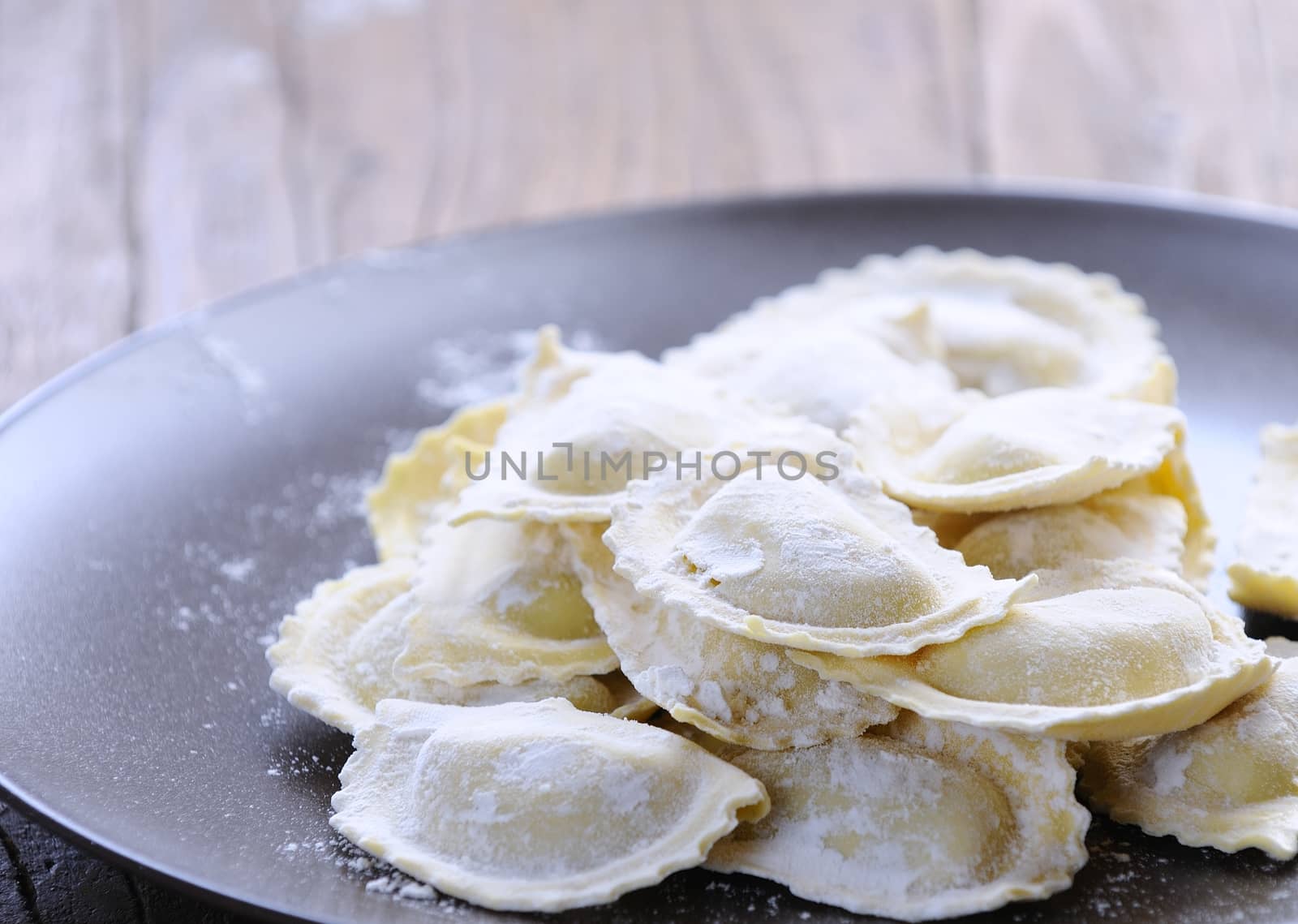 Preparing fresh ravioli at the kitchen table.