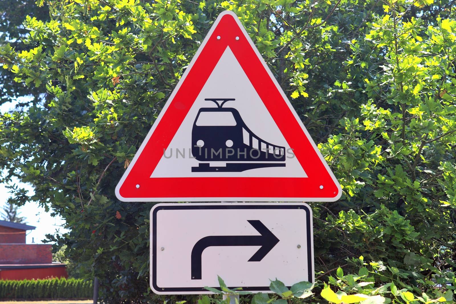 Multiple railroad tracks with junctions at a railway station in a perspective view