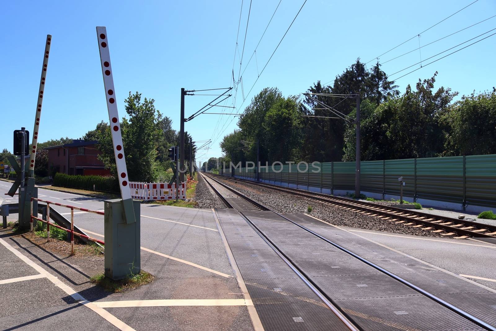 Multiple railroad tracks with junctions at a railway station in a perspective view