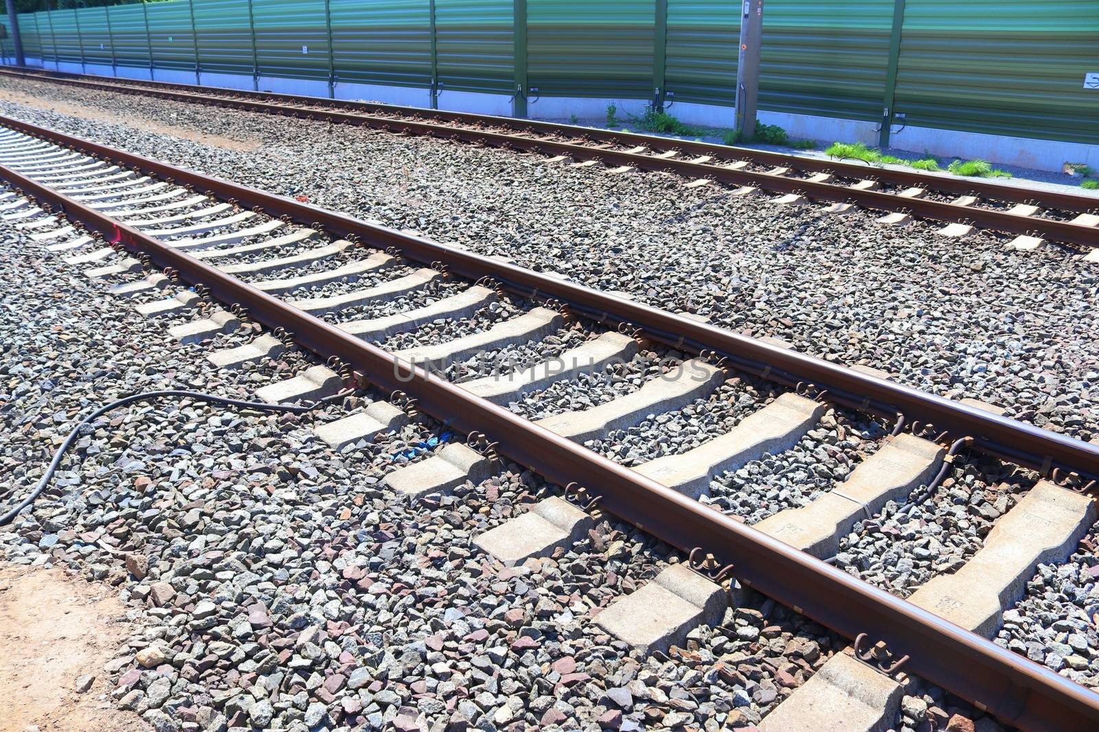 Multiple railroad tracks with junctions at a railway station in  by MP_foto71