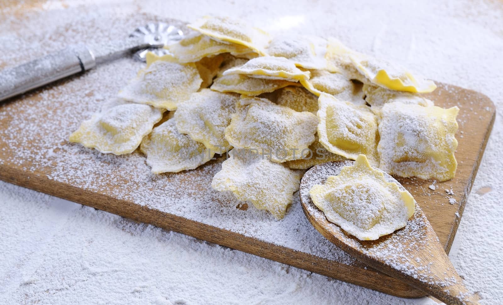Preparing fresh ravioli at the kitchen table.