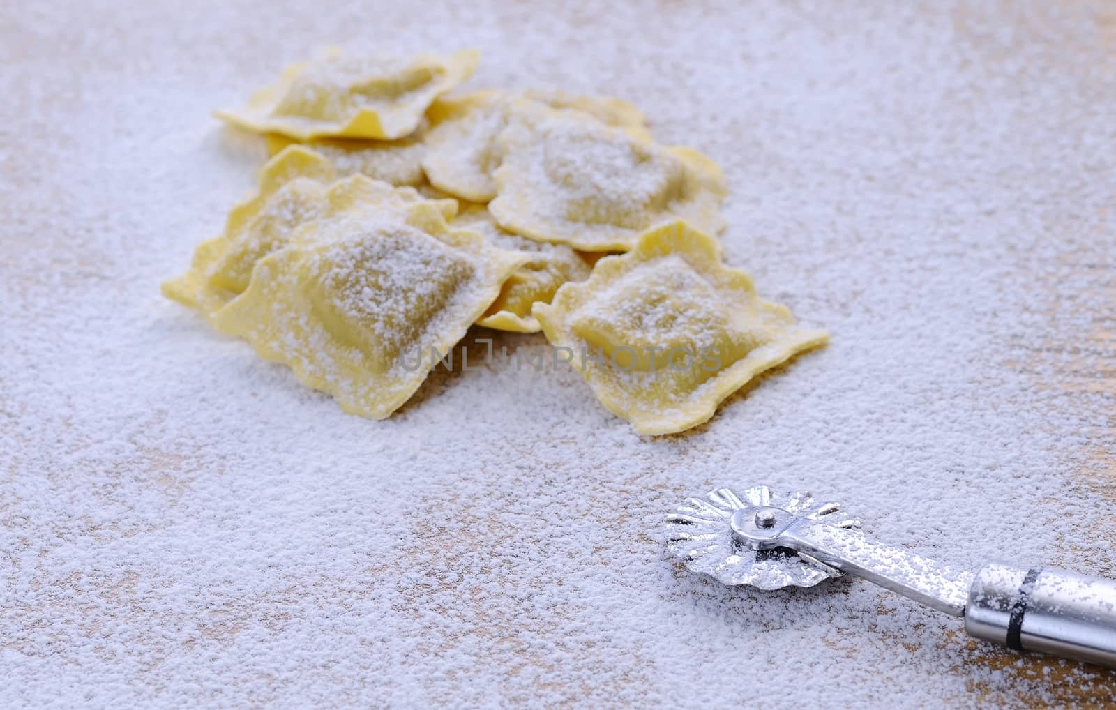Preparing fresh ravioli at the kitchen table.