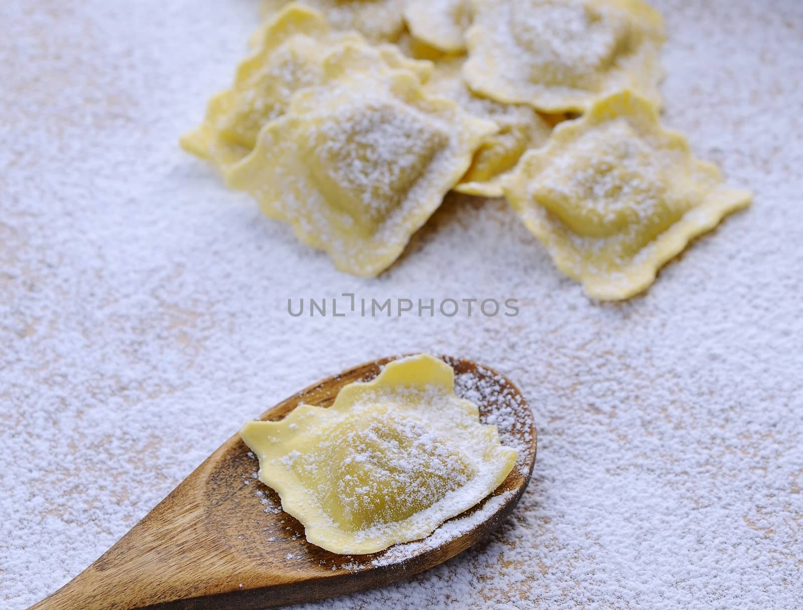 Preparing fresh ravioli at the kitchen table.