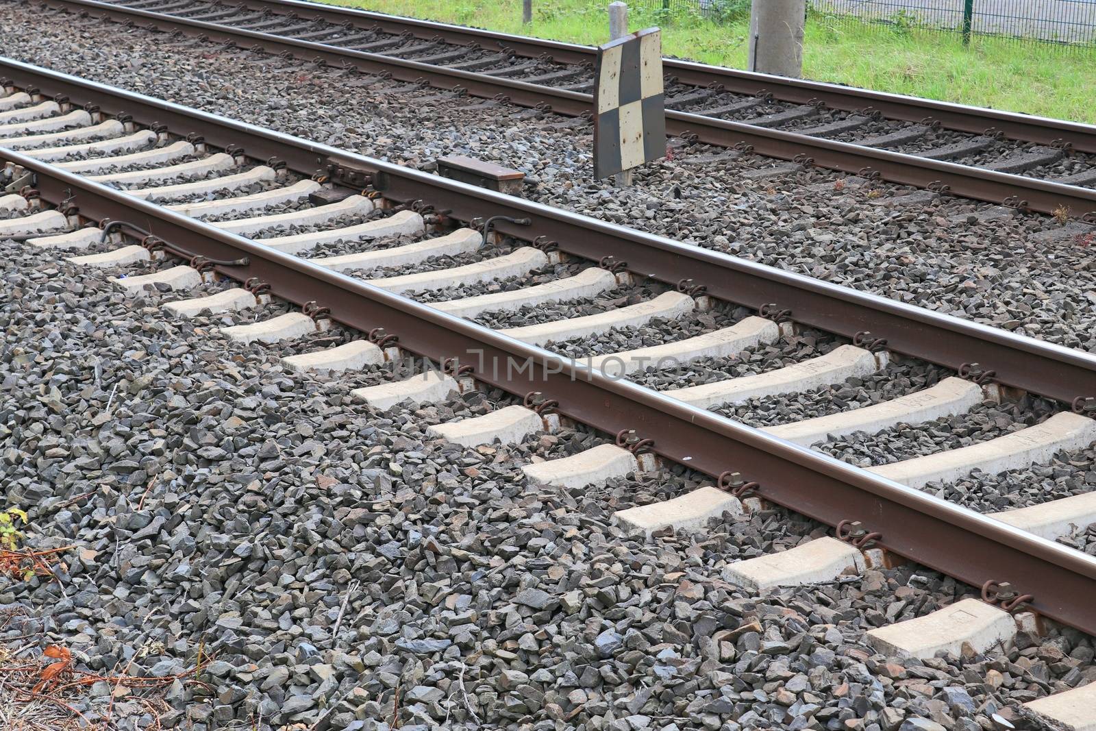 Multiple railroad tracks with junctions at a railway station in  by MP_foto71