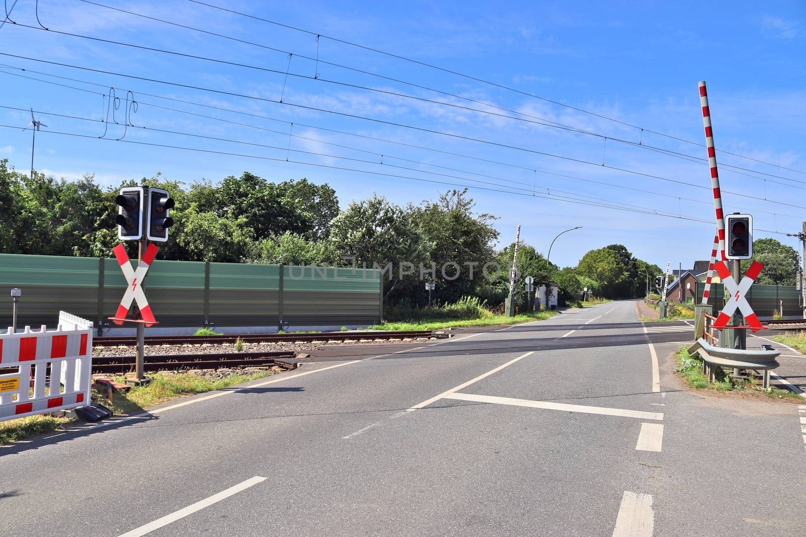 Multiple railroad tracks with junctions at a railway station in a perspective view