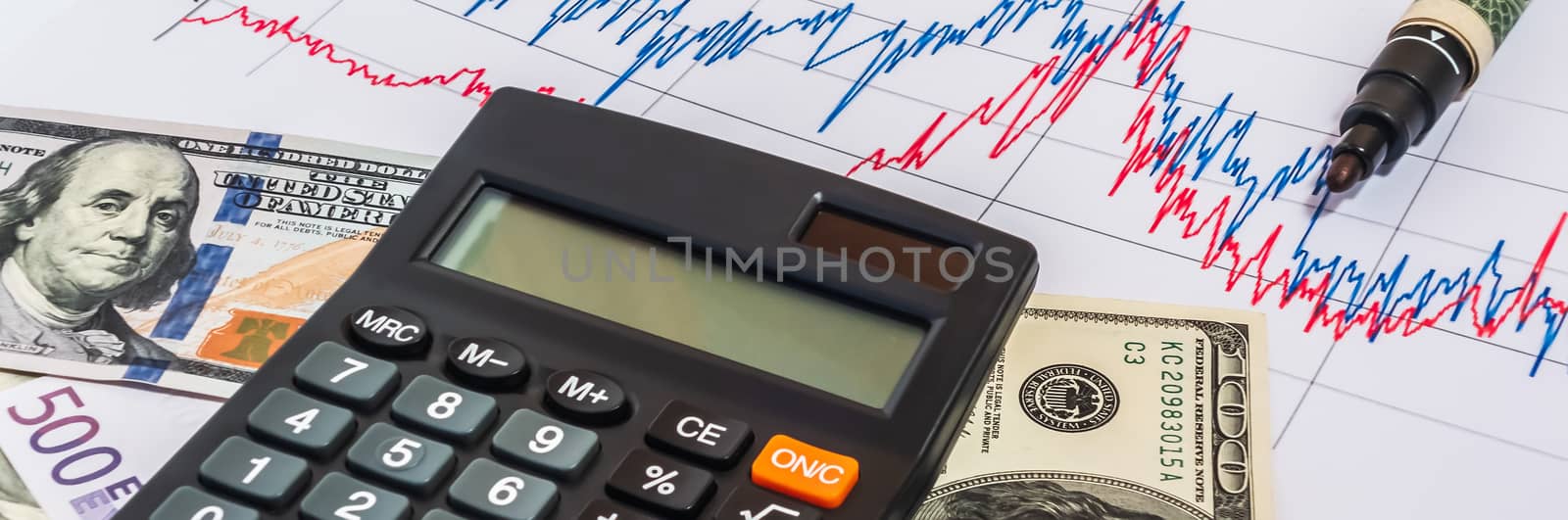 Black calculator Logarithmic graph of the course Bitcoin to USD. Crypto currency money exchange for trade. Business concept Black electronic solar calculator Bitcoin to USD