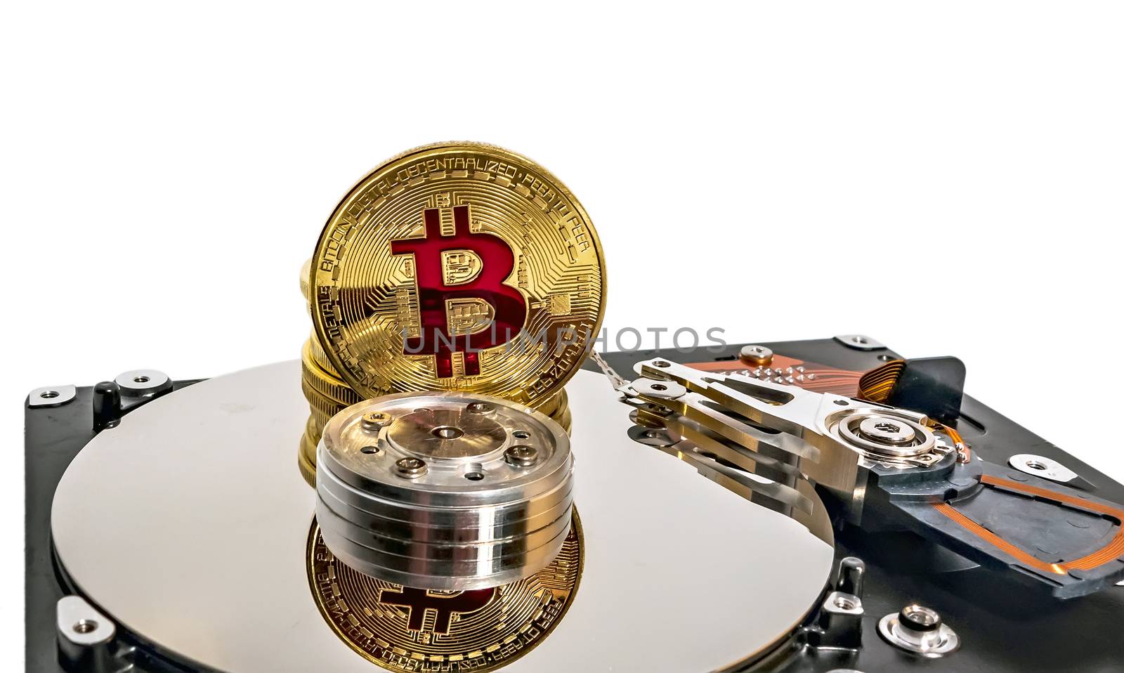 Physical Coin Cryptocurrency BTC Gold Plated Bitcoin in laptop hard disk server network concept. Crypto currency blockchain Coin virtual money concept isolated on white background.