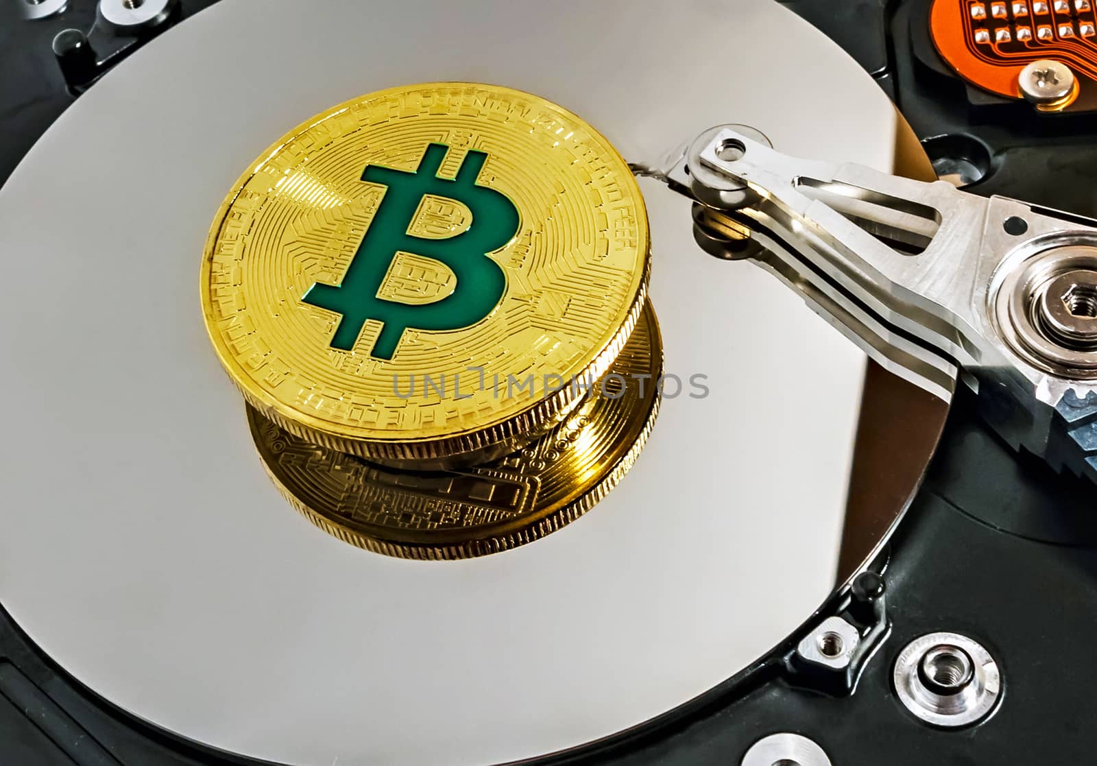 Open computer hard disk drive HDD background BTC Gold Plated Bitcoin Coin wallet network concept