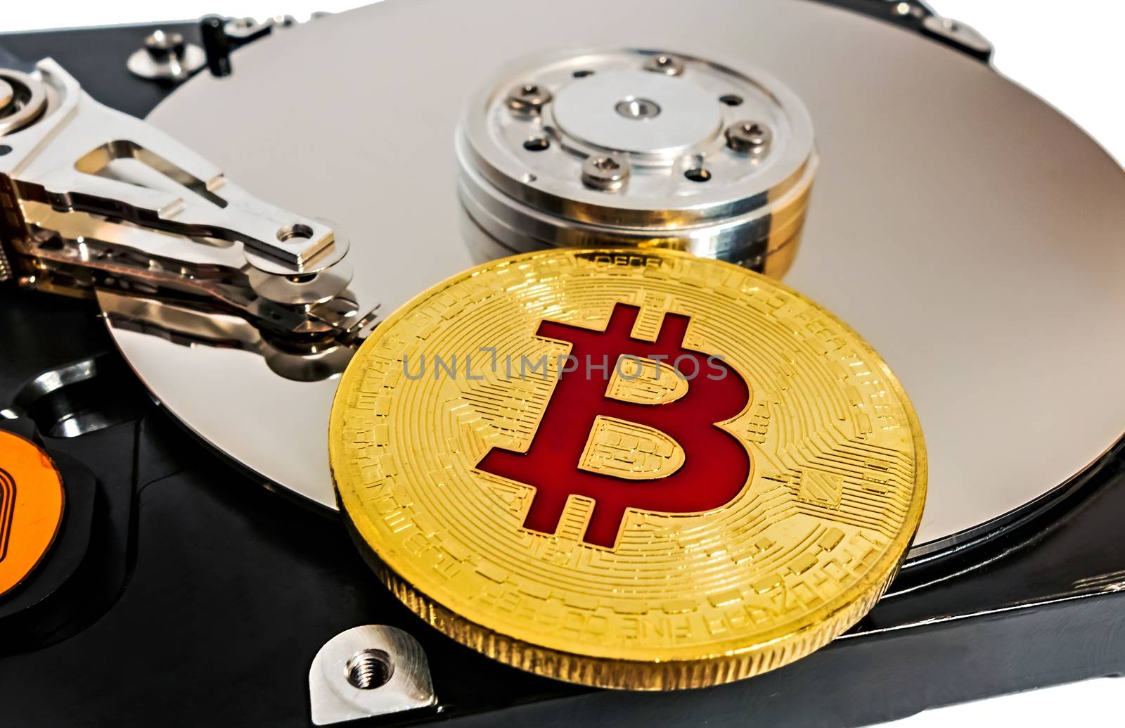 Physical Coin Cryptocurrency BTC Gold Plated Bitcoin in laptop hard disk server network concept wallet. Crypto currency blockchain Coin virtual money concept isolated on white background.