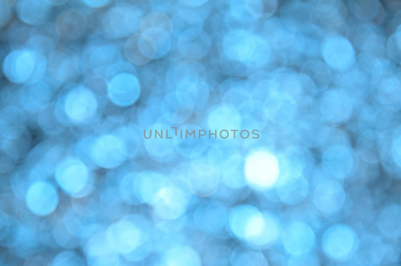 Blue colored abstract background with bokeh, for the new year and christmas