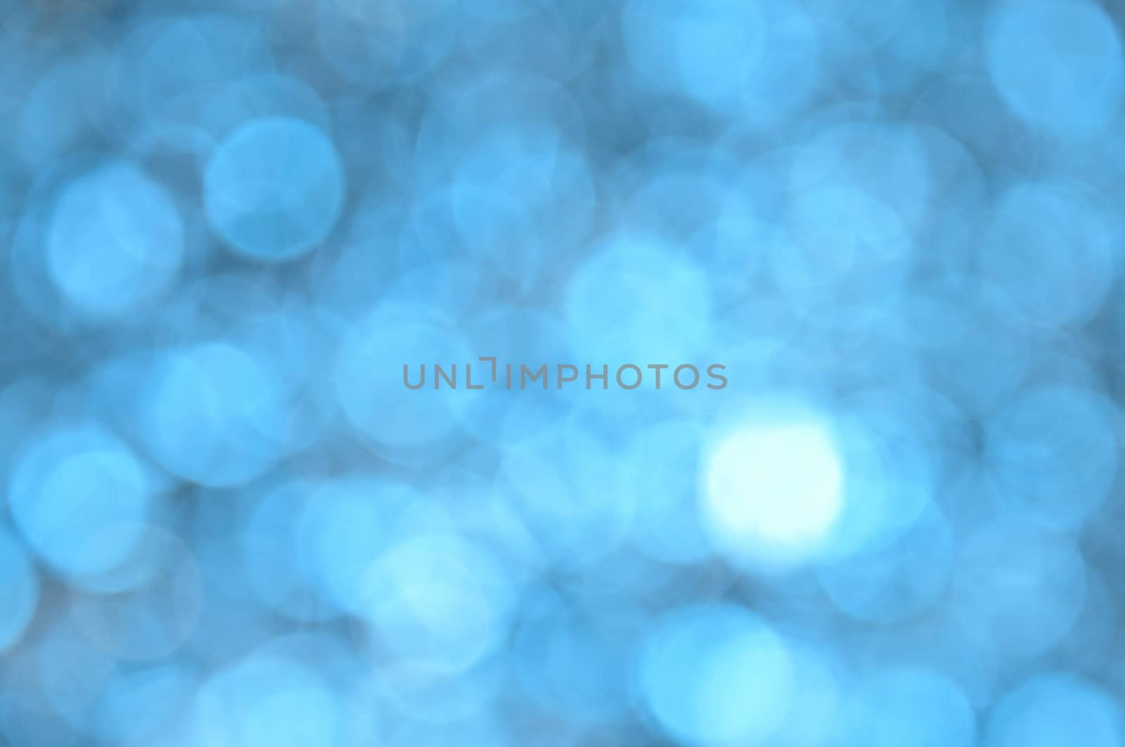 Blue colored abstract background with bokeh by moviephoto