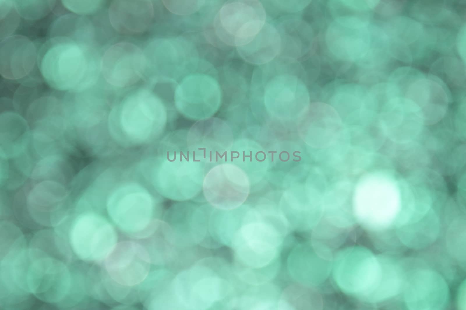 Turquoise colored abstract background with bokeh by moviephoto