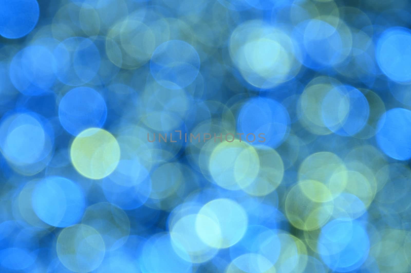 Blue,yellow,cyan,green colored abstract background with bokeh by moviephoto