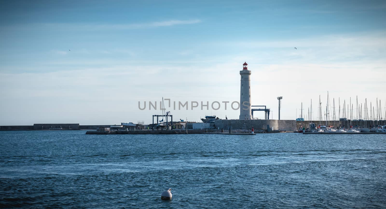 Sete, France - January 4, 2019: Architecture detail of Port Saint Louis lighthouse on a winter day