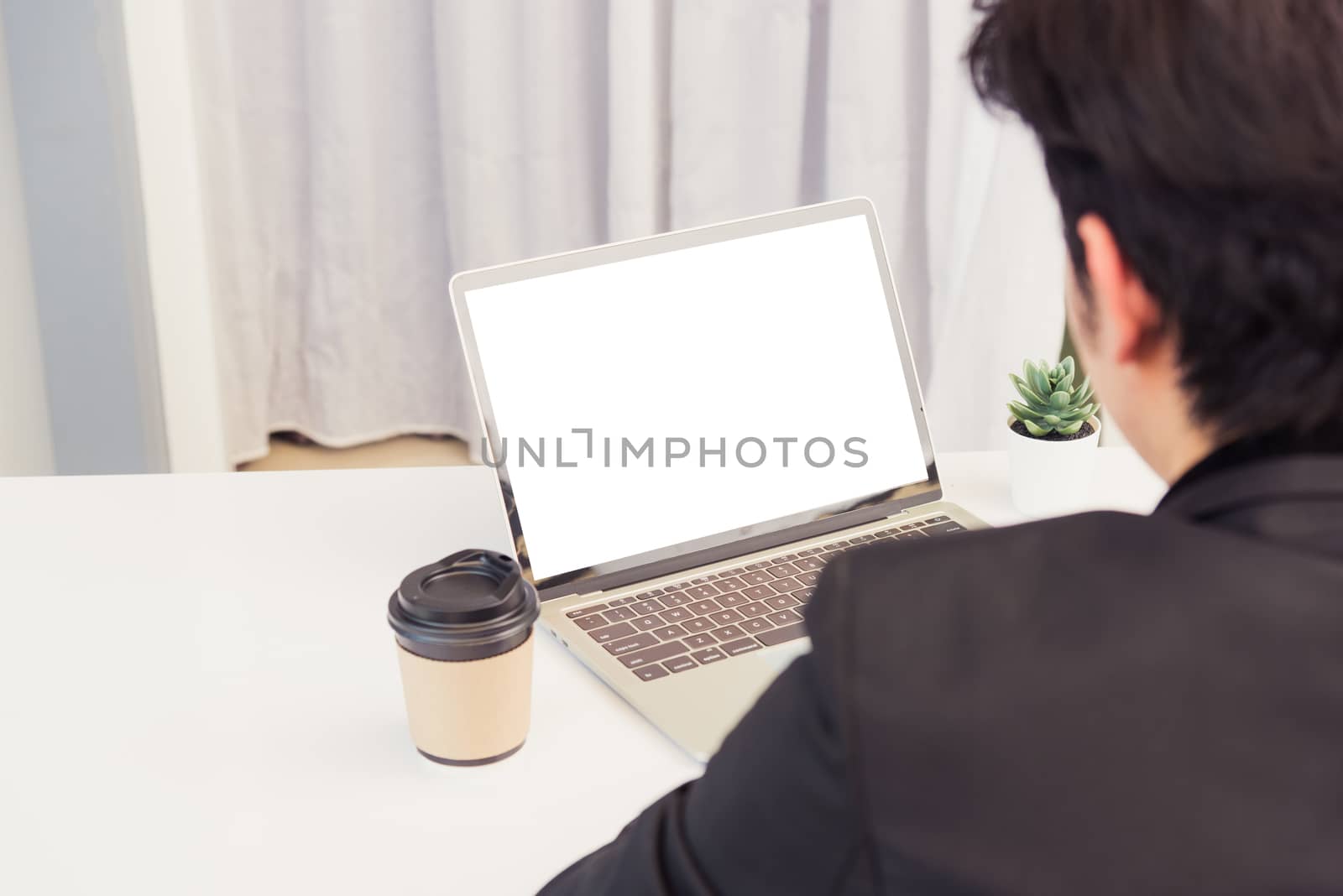 Businessman wearing suit video conference call by laptop compute by Sorapop