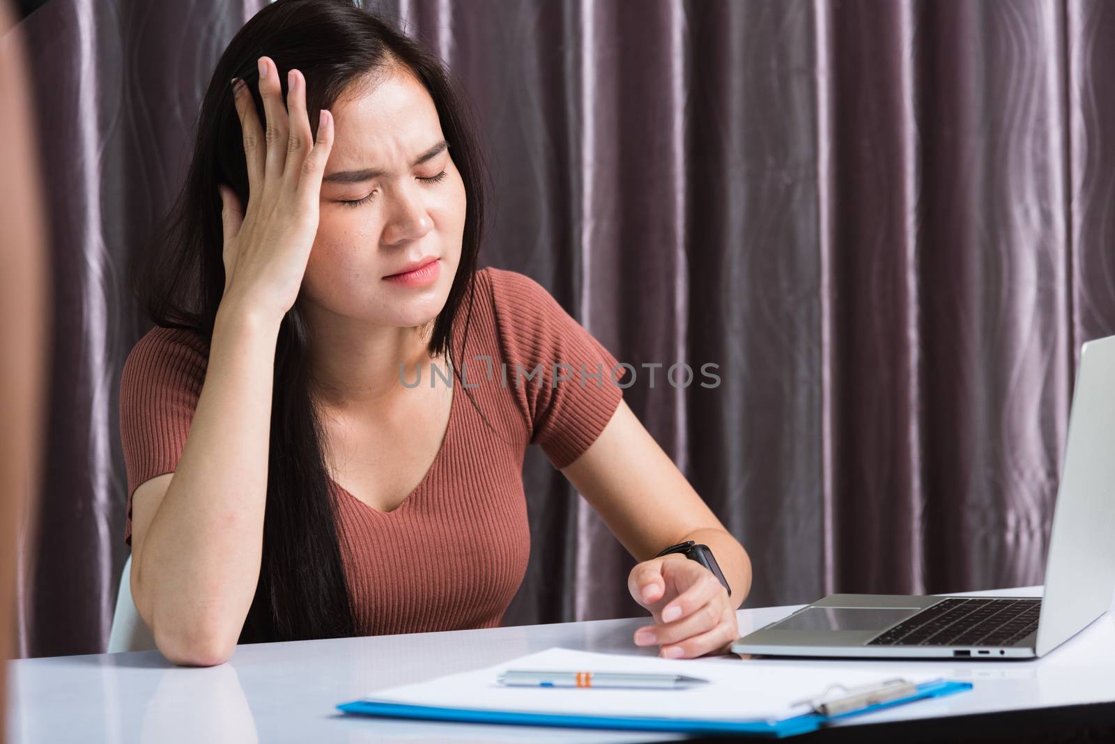 Work from home, Fatigued or strain Asian business young beautiful woman sitting on desk workspace feeling tired stressed hand hold head after long sedentary laptop computer technology at home office