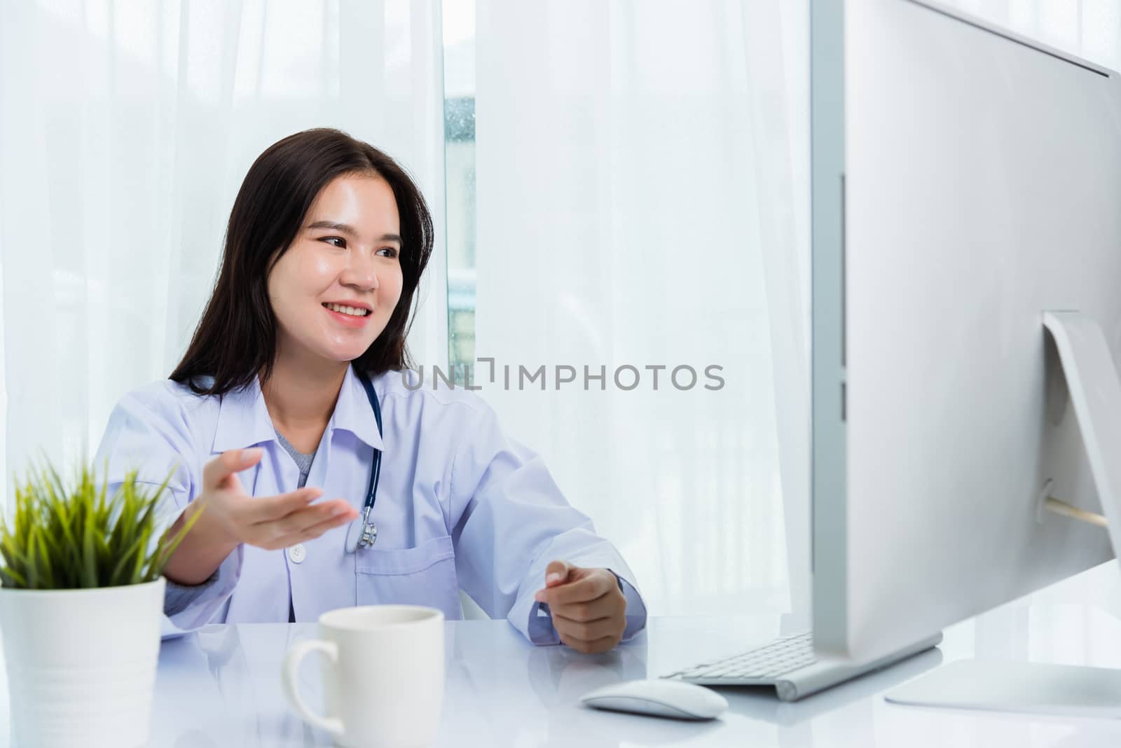 Woman doctor video call online raise hand to explain to patients by Sorapop