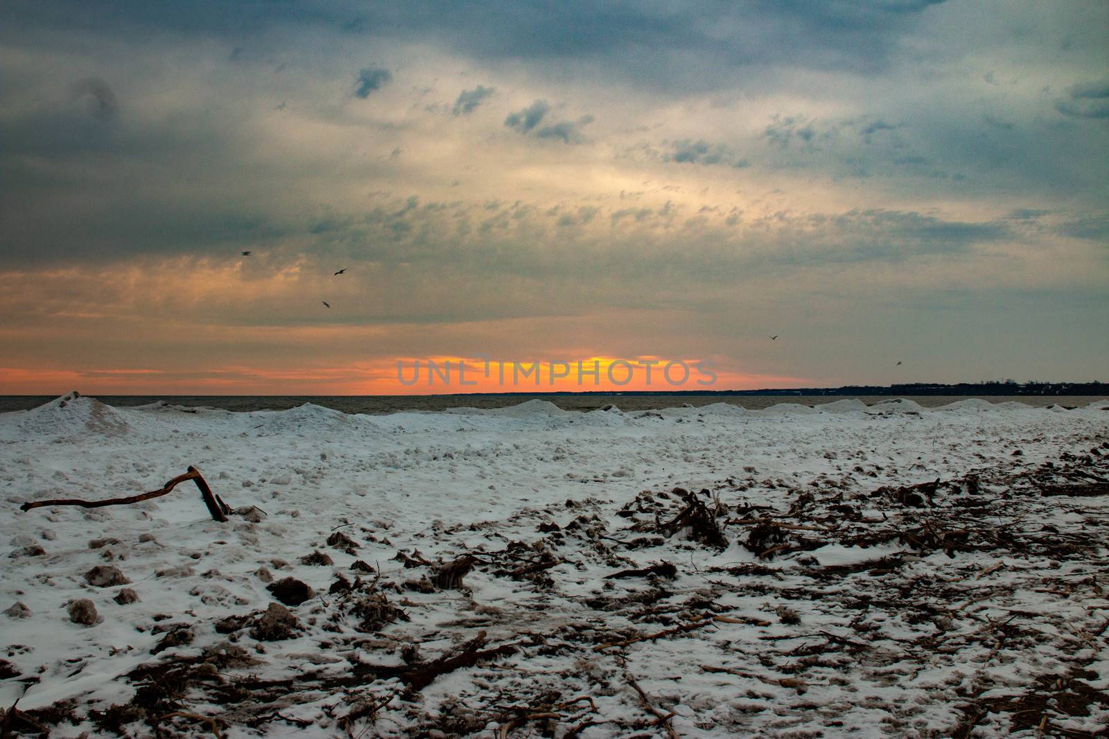 Sunset in the winter season over Port Stanley Ontario which is lake erie. by mynewturtle1