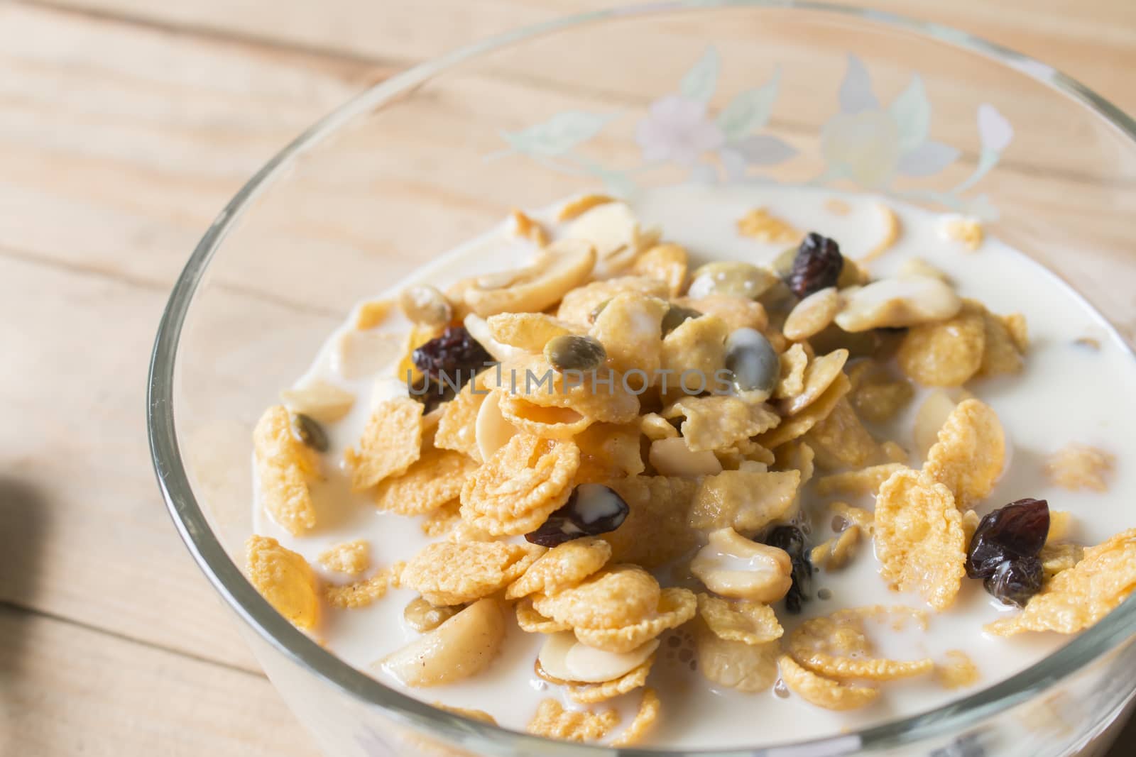 Bowl of cornflakes in milk on table,breakfast time