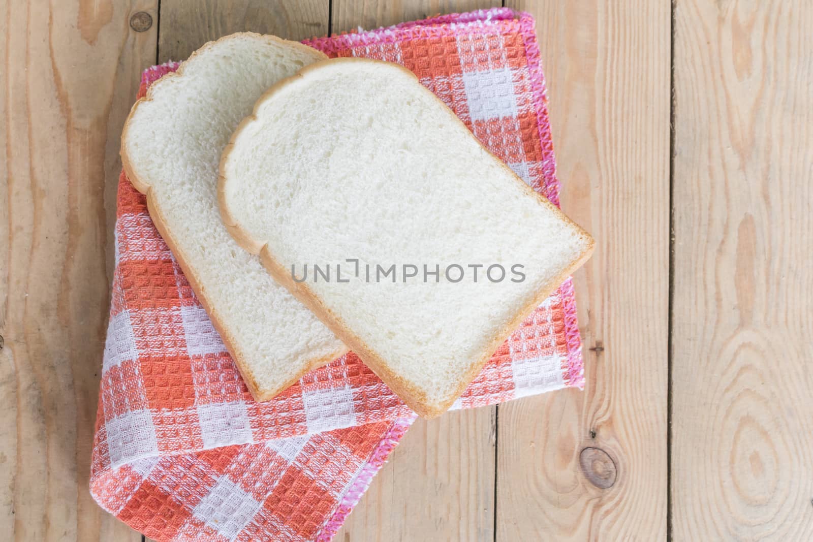 Two slice bread on napkin,food background