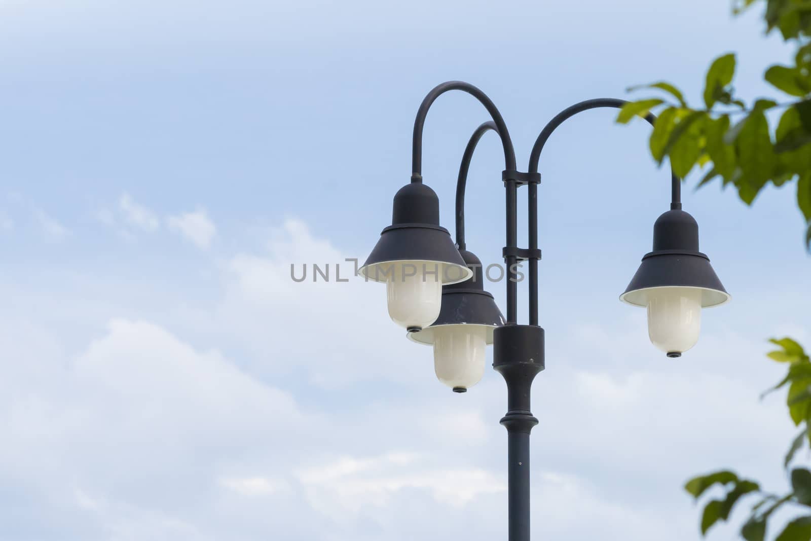 Street lamp on blue sky background