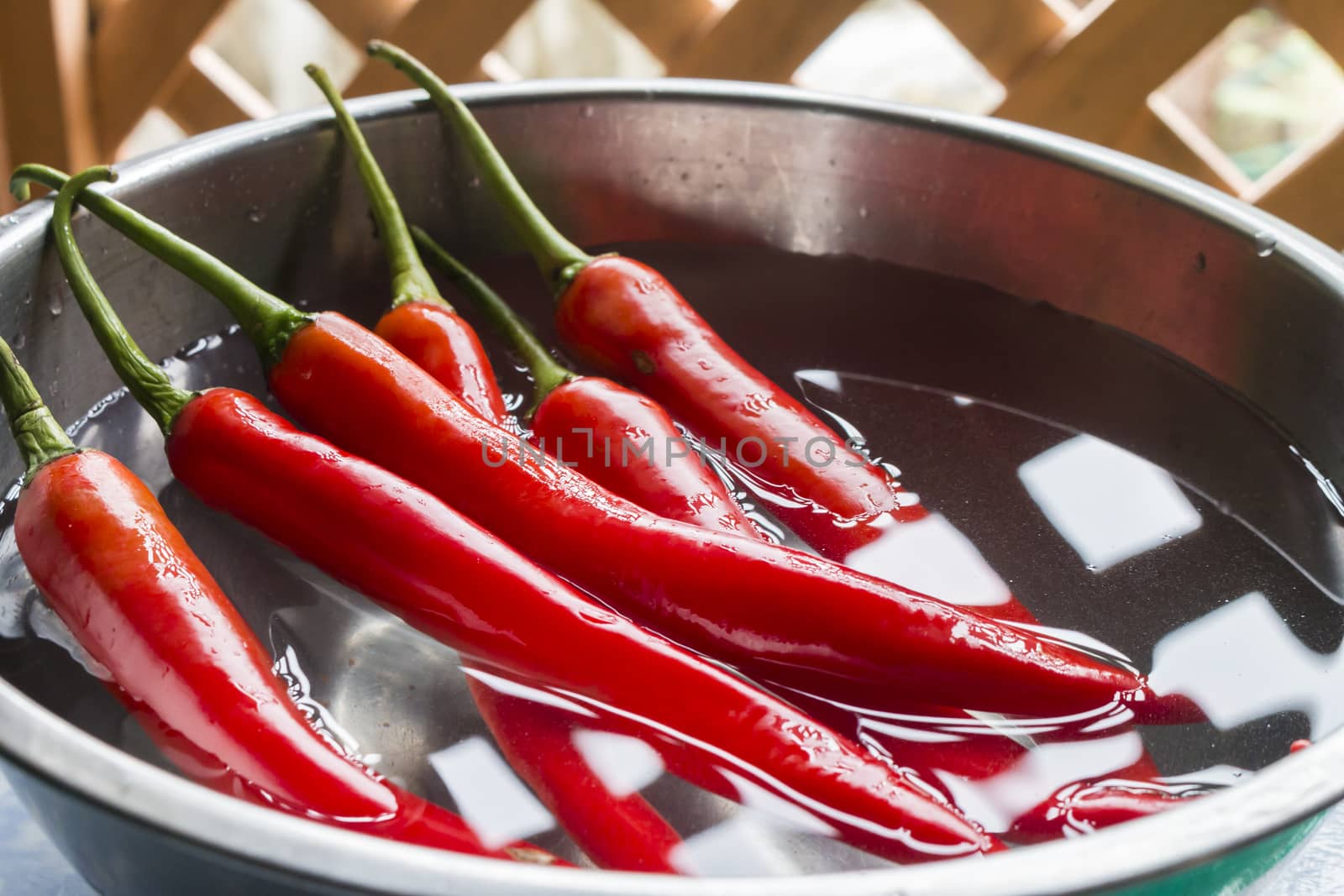 Wash the red chilli pepper in bowl,