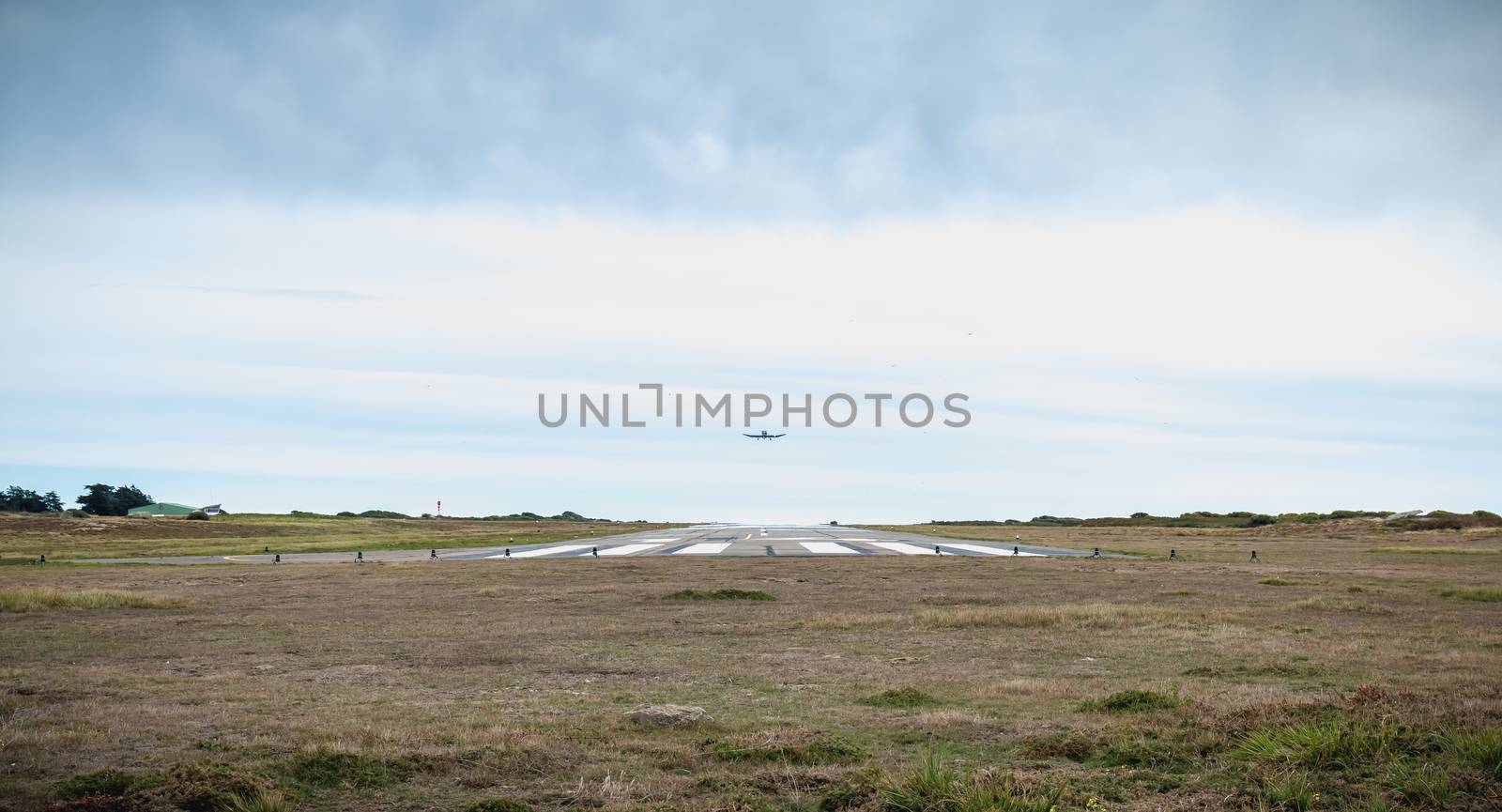 Port Joinville, France - September 16, 2018: Small passenger plane taking off from an airfield on Yeu Island near France on a fall day