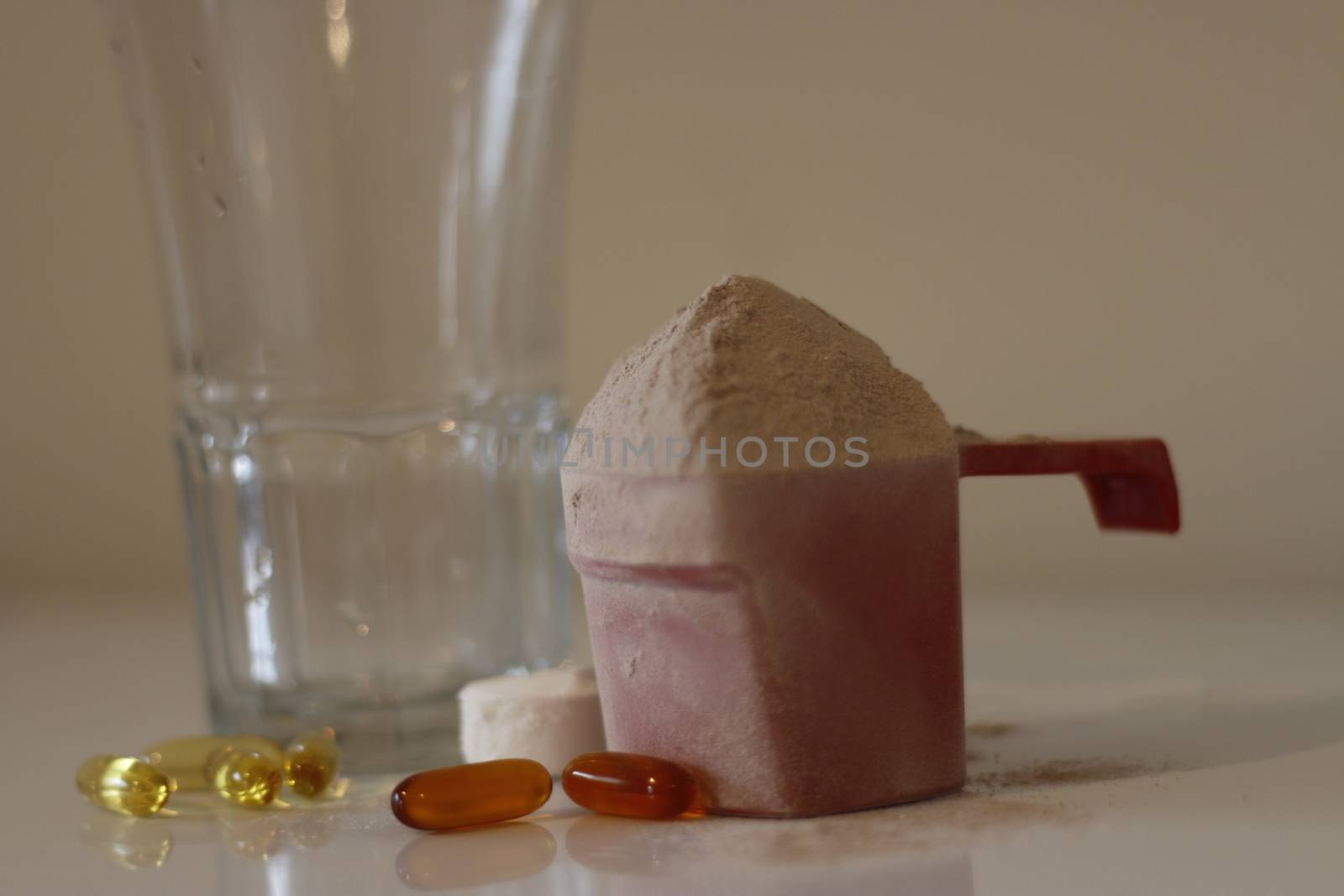 Pile of cocoa protein powder isolated over the white background