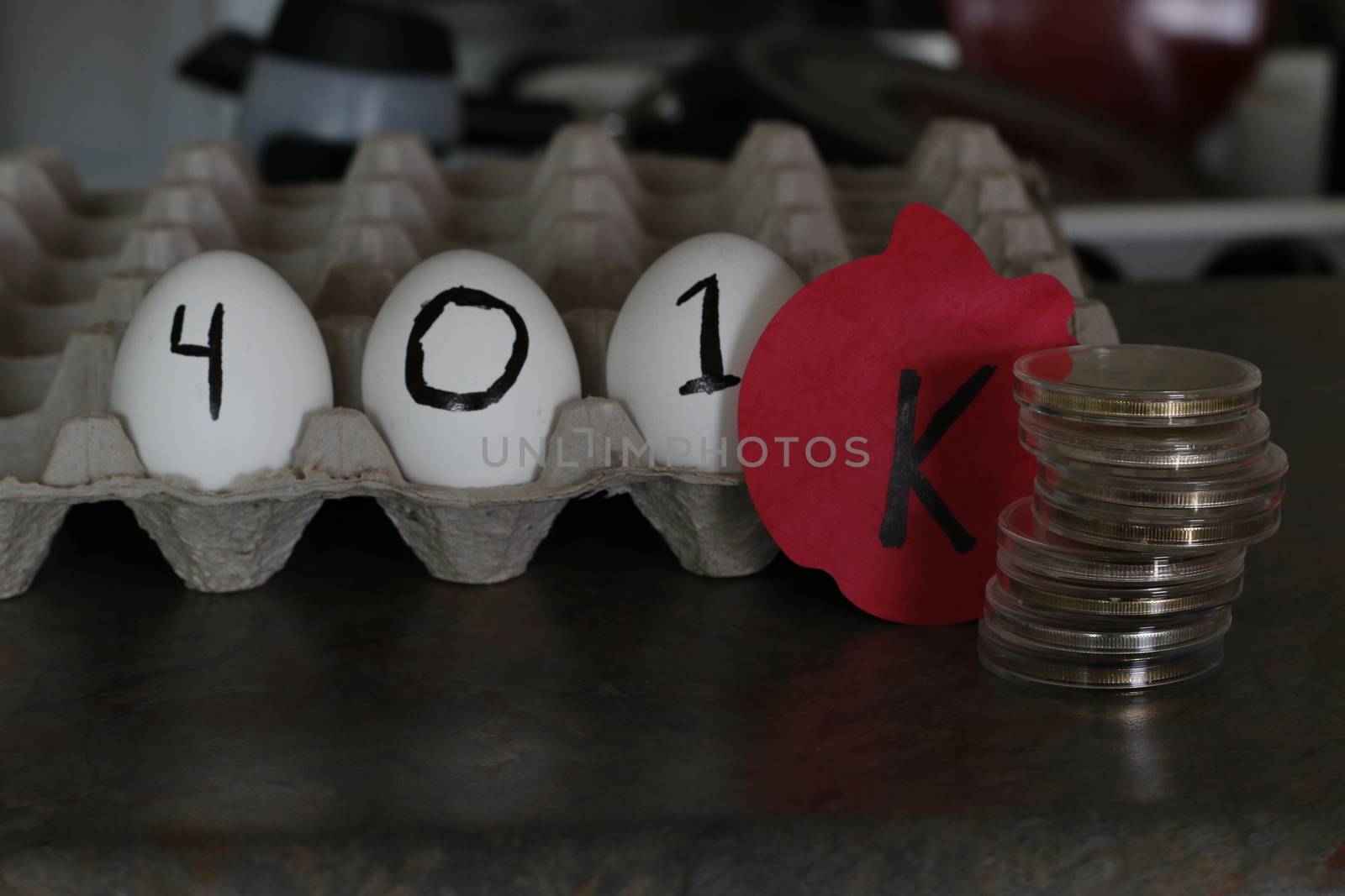 The word 401k wrote on eggs. Theme of nest egg for retirement.