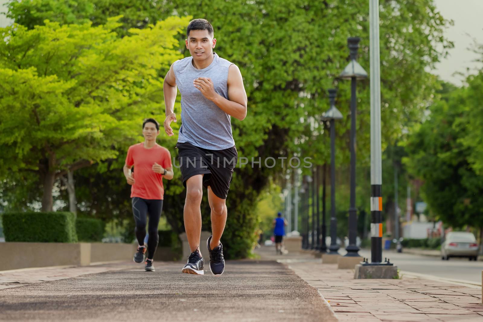 Portrait of handsome man running in the park in early morning. H by numberone9018