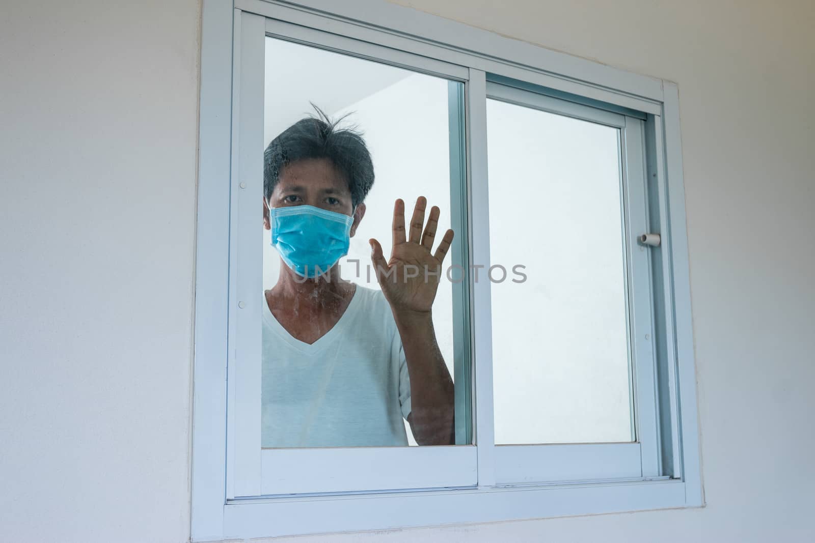 Man in isolation at home for coronavirus outbreak (COVID-19), Quarantine to prevent the spread of the coronavirus (COVID-19)
