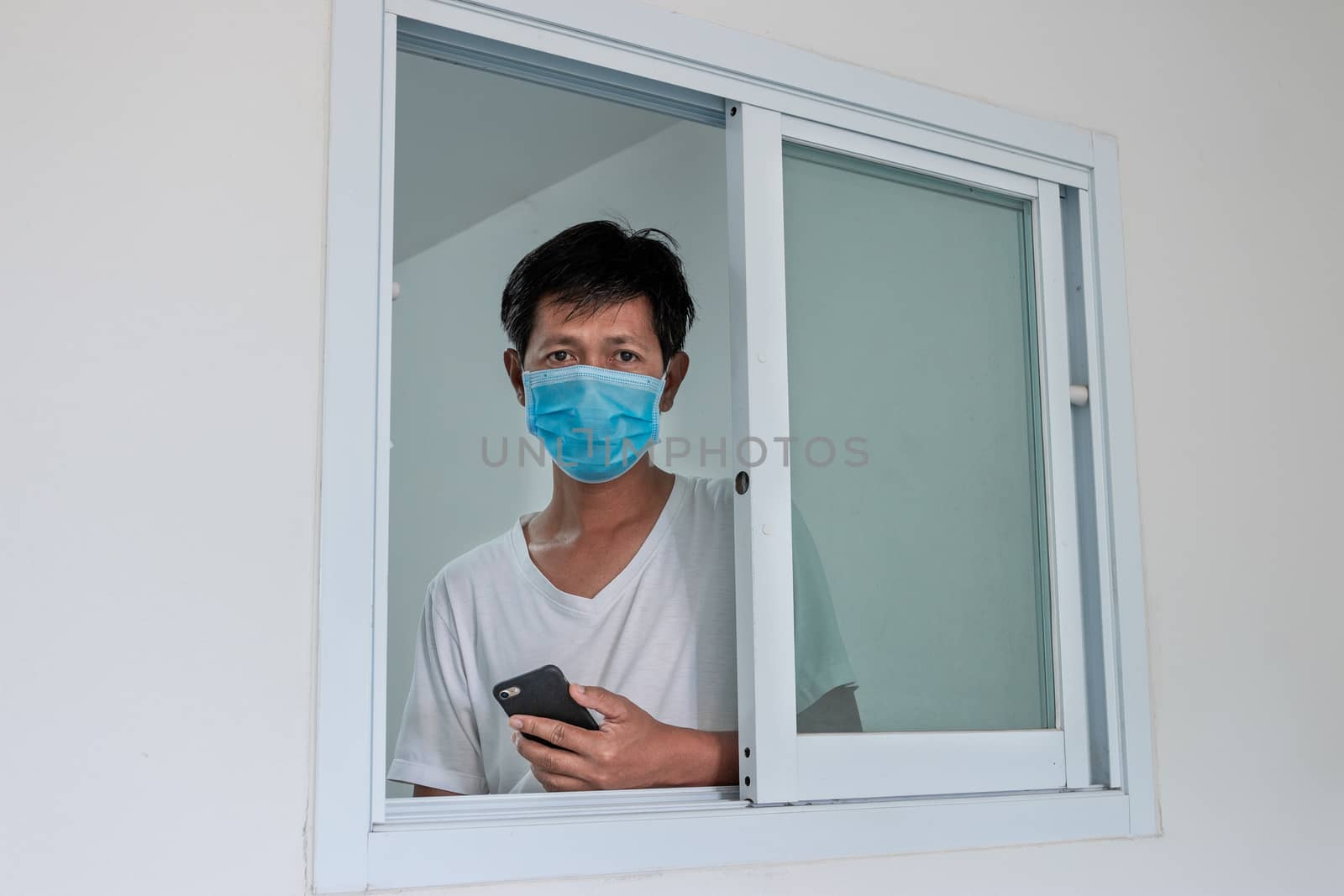 Man in isolation at home for coronavirus outbreak (COVID-19), Quarantine to prevent the spread of the coronavirus (COVID-19)