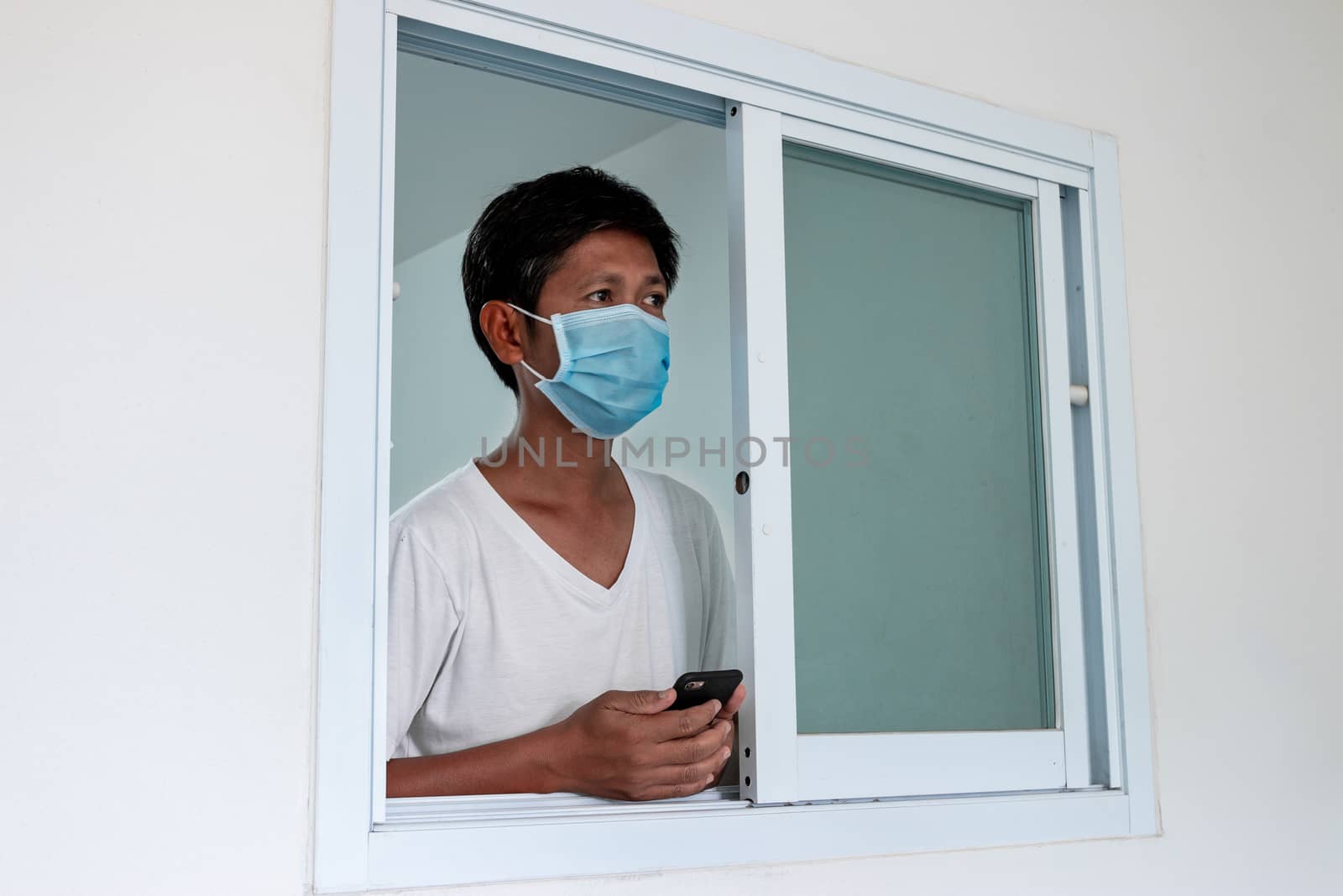 Man in isolation at home for coronavirus outbreak (COVID-19), Quarantine to prevent the spread of the coronavirus (COVID-19)